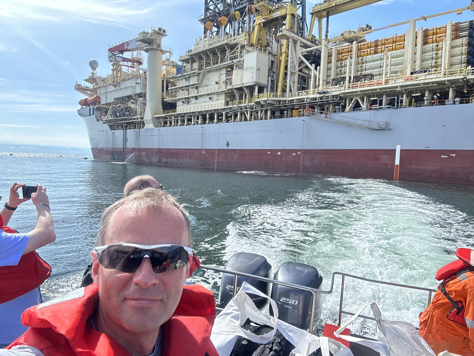 Daniel Czarkowski on a crew boat approaching an FPSO