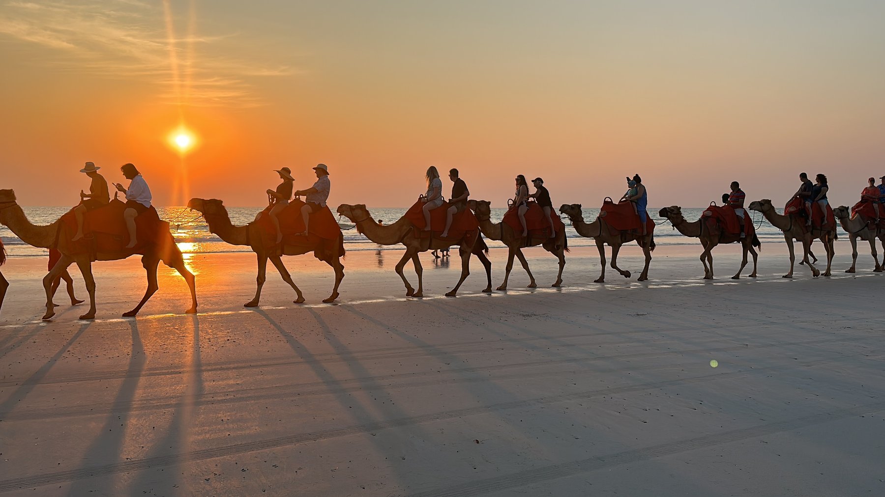 Camel train at sunset on Cable Beach, Western Australia