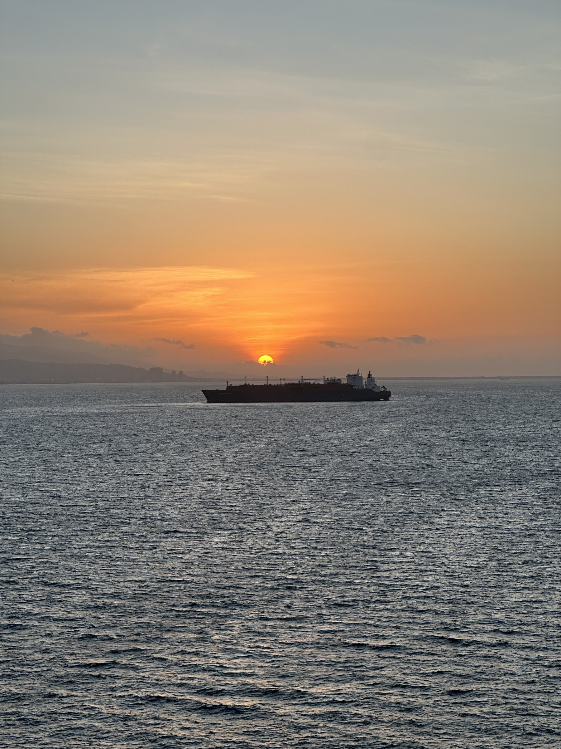 Drilling rig silhouette at sunset