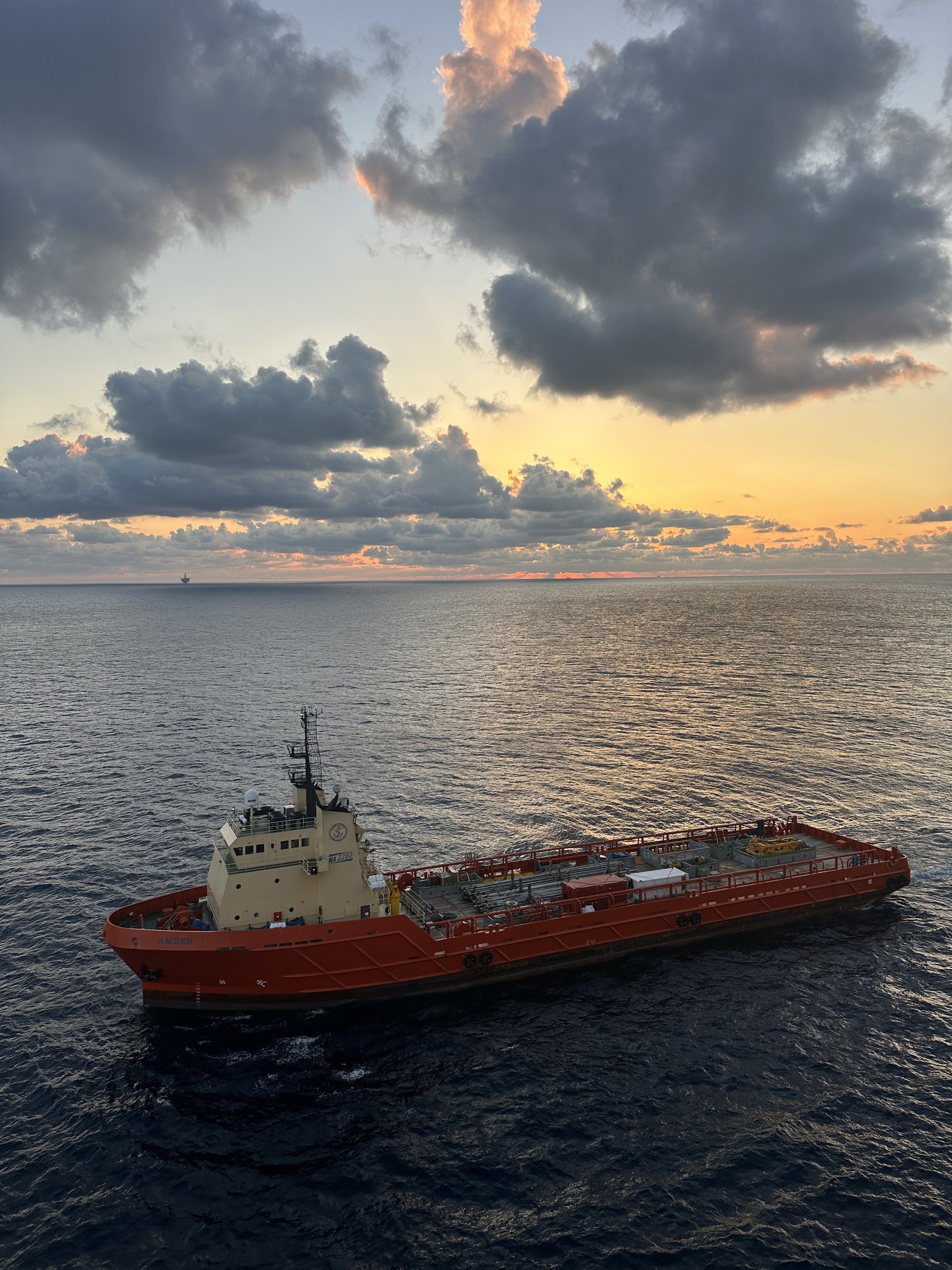 Offshore support vessel at sunset